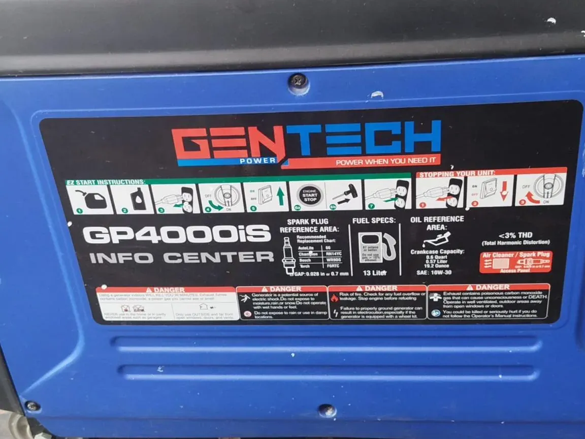 Blue Gentech GP4000iS inverter generator side panel with start instructions and spark plug and oil specifications