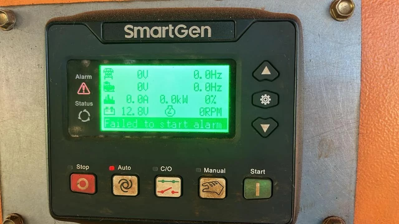 SmartGen controller showing a failed to start alarm with 0 V, 0 rpm and 12.8 V battery, on an orange panel